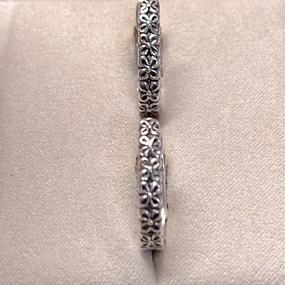 Sparkle in these Sterling Silver & Diamond Hoop Earrings with 14k Gold accents. - Picture 2 of 7